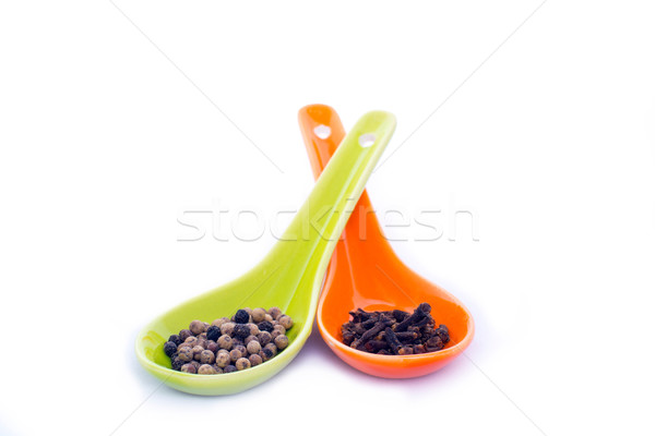 Peper kruidnagel twee keramische lepels Stockfoto © cwzahner