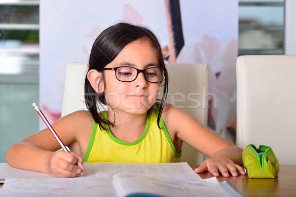 Little cute girl doing homework Stock photo © cwzahner