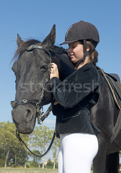 Fiatal lovaglás lány fiatal lány fekete csődör Stock fotó © cynoclub