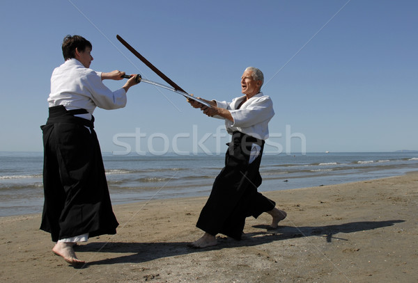 Aikido praia dois adultos treinamento homem Foto stock © cynoclub