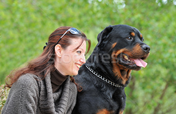 Fiatal nő kutya gyönyörű mosolyog fajtiszta rottweiler Stock fotó © cynoclub
