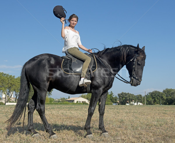 Jóvenes equitación nina joven negro semental Foto stock © cynoclub