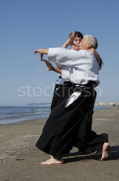 Opleiding aikido twee volwassenen strand man Stockfoto © cynoclub