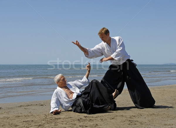 Aikido praia dois adultos treinamento homem Foto stock © cynoclub