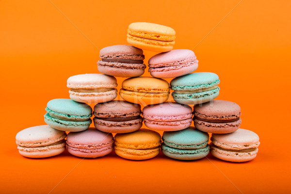Set of macarons on orange background Stock photo © cypher0x