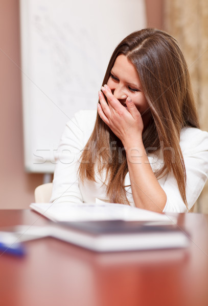 Businesswoman laughing in a meeting Stock photo © d13