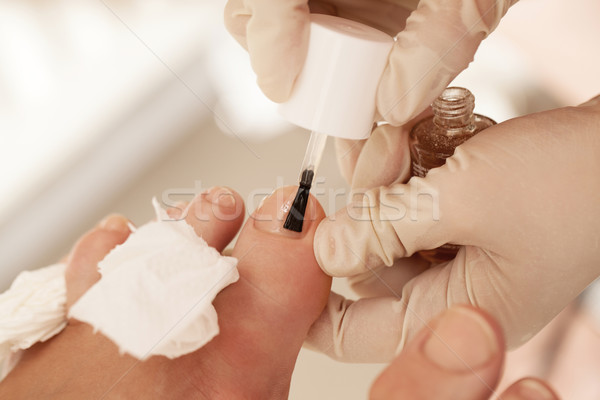 Applying nail polish during pedicure at beauty spa Stock photo © d13