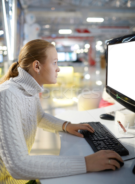 Young girl and blank monitor. Stock photo © d13
