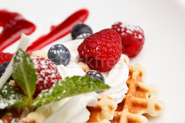 Waffle and cream topped with fresh berries Stock photo © d13