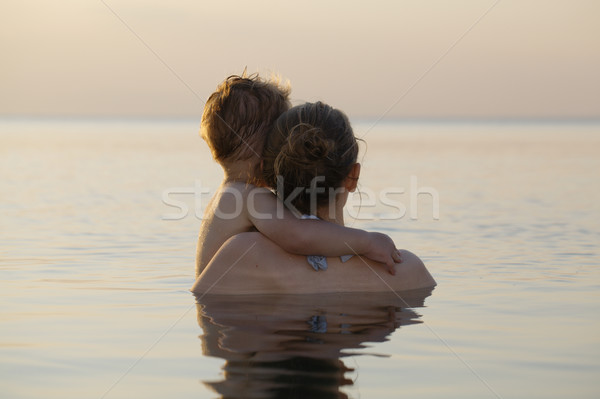 Mother and son watching the sunset Stock photo © d13