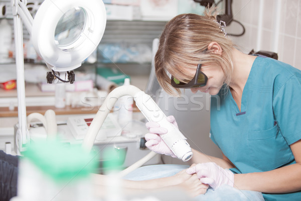 Foot treatment with a laser in clinic Stock photo © d13