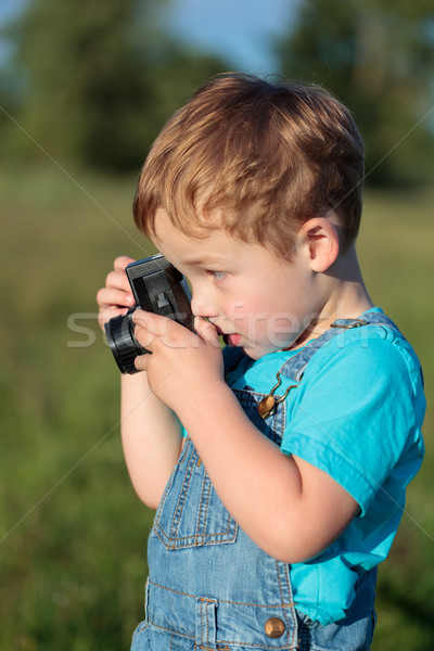 Little child taking pictures outdoor Stock photo © d13