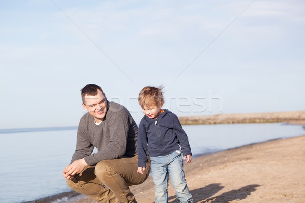 Father with his young son at the beach Stock photo © d13