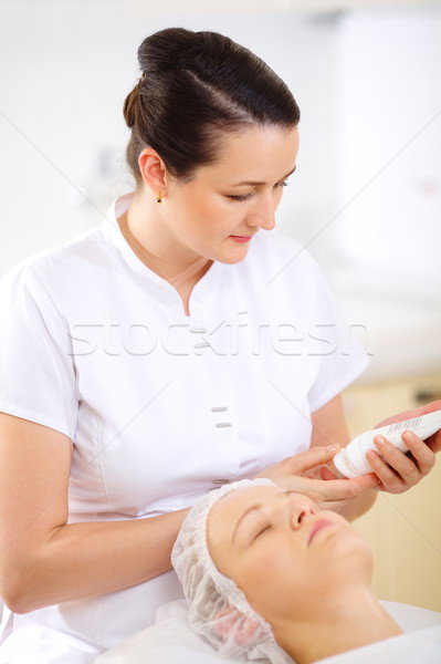 Cosmetician with cosmetic before procedure Stock photo © d13