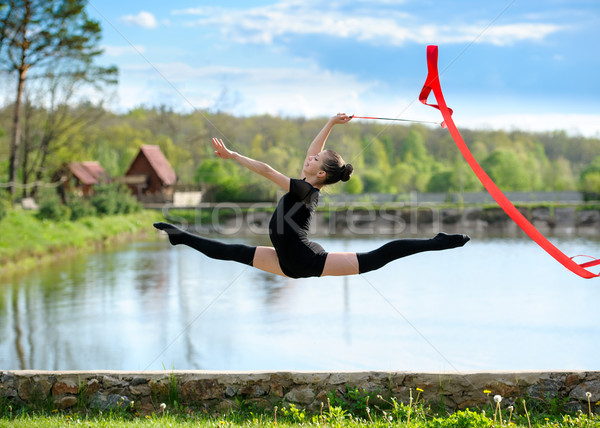 Ritmik jimnastikçi kız egzersiz şerit açık Stok fotoğraf © d13