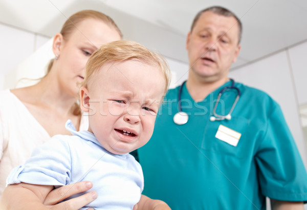 Boy is frightened and crying in a medical study. Stock photo © d13