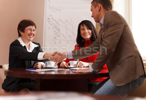 Business man and woman shaking hands Stock photo © d13