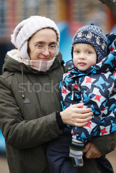 Woman holding her small son Stock photo © d13