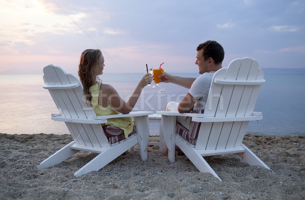 Stock photo: Romantic couple toasting the sunset