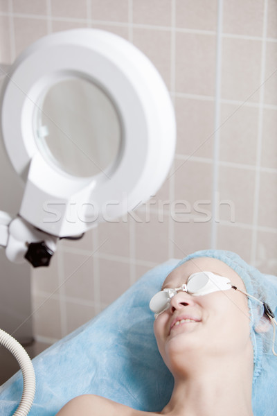 Smiling woman before cosmetologial procedure in clinic Stock photo © d13