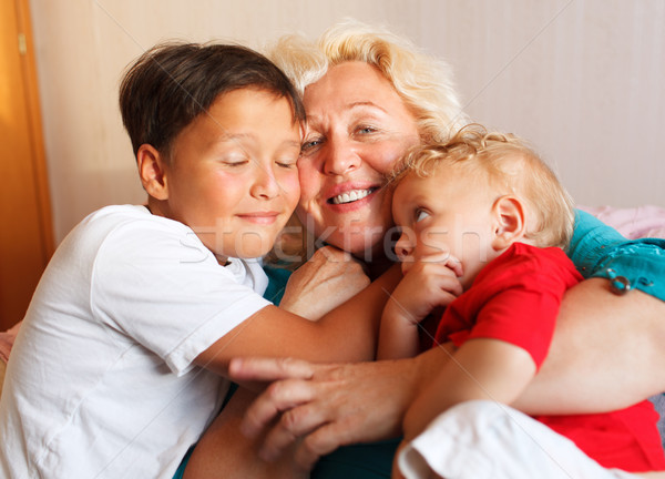 Happy grandmother hugging with her grandsons Stock photo © d13