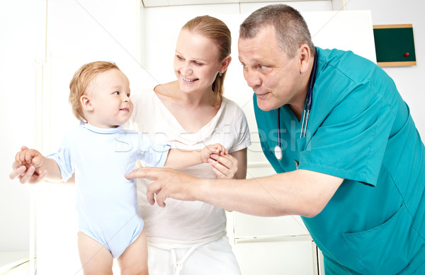 Doctor, boy, happy mother. Stock photo © d13