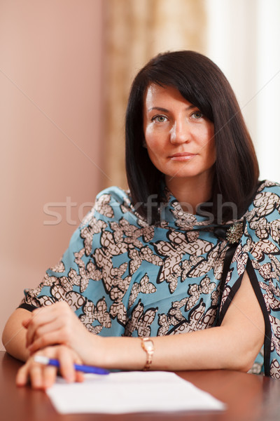 Attractive woman writing notes Stock photo © d13