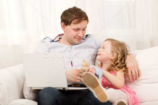 Daughter wants to play with busy dad Stock photo © d13