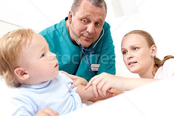 Doctor listen the baby with stethoscope. Stock photo © d13