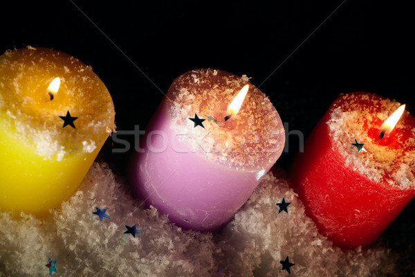 Three candles with artificial snow. Stock photo © d13