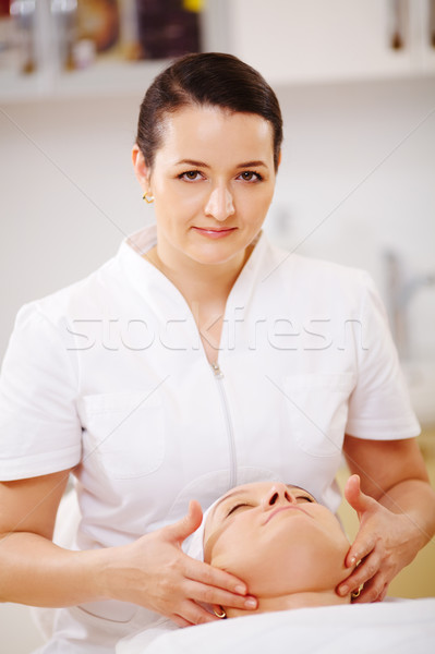 Facial treatment with massage therapist during seance at beauty spa Stock photo © d13