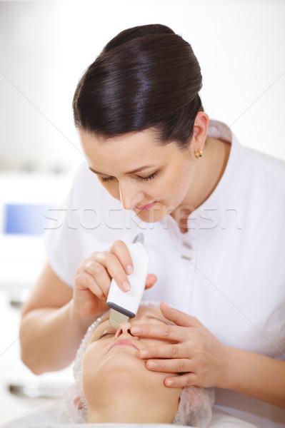 Cosmetician making ultrasonic face cleaning Stock photo © d13