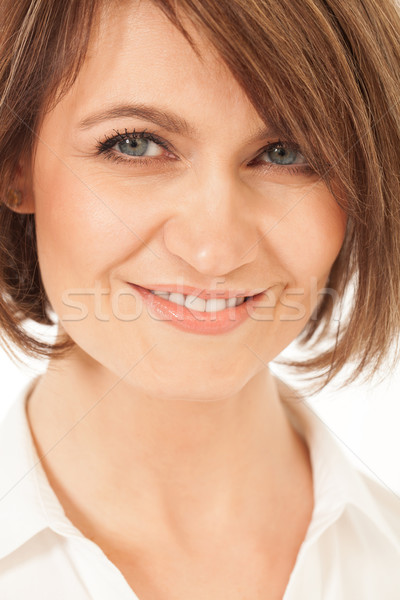 Studio shot of beautiful adult woman smiling at camera Stock photo © d13