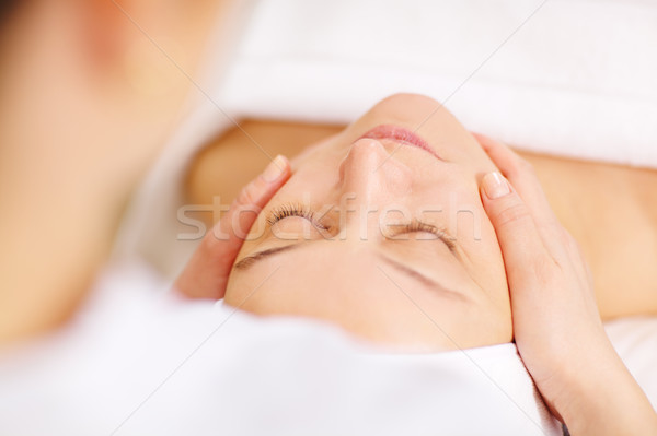Woman under professional facial massage in beauty spa Stock photo © d13