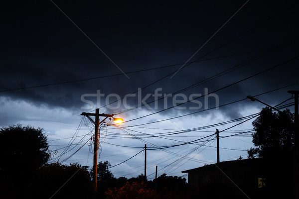 Street light at night with a stormy sky background Stock photo © daboost