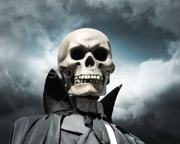 grim reaper. death's skeleton on a cloudy dramatic sky Stock photo © daboost