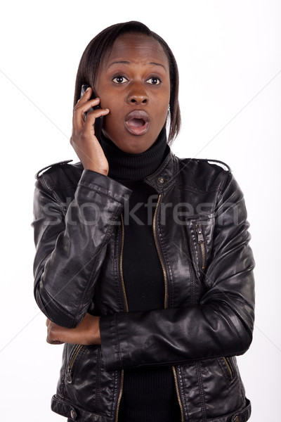 Nieuws jonge vrouw telefoon geschokt vrouw jonge Stockfoto © danienel