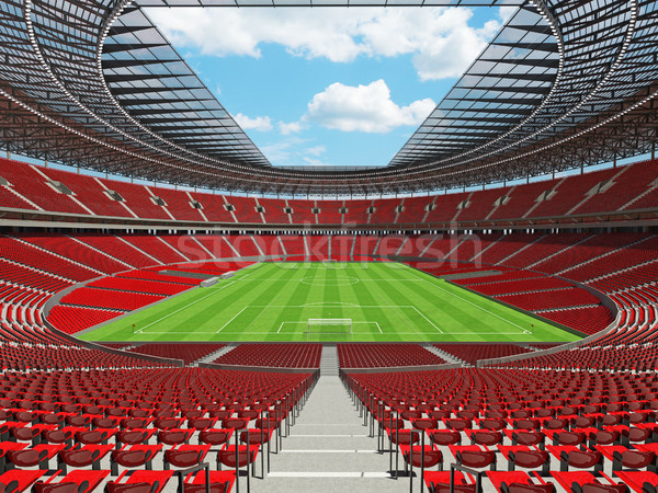 Stock photo: 3D render of a round football -  soccer stadium with red seats