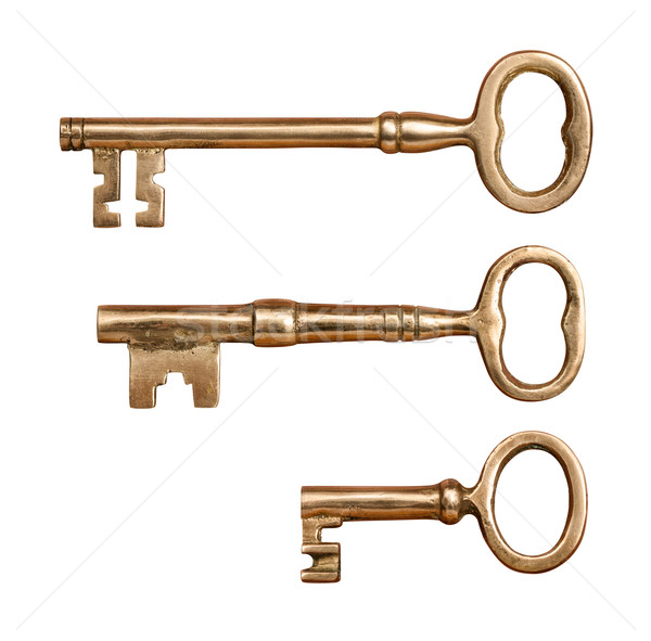 Három antik sárgaréz kulcsok izolált fehér Stock fotó © danny_smythe