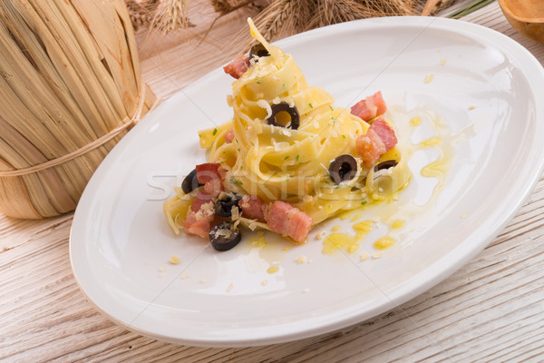 tagliatelle with bacon and blacken to olive ones Stock photo © Dar1930