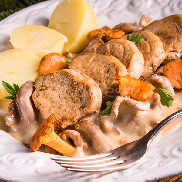 potatoes with pork medallions and chanterelle sauce Stock photo © Dar1930