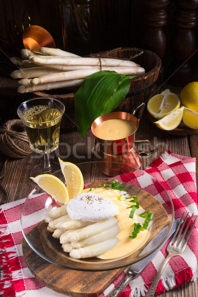 white asparagus served with a fine hollandaise sauce and Poache Stock photo © Dar1930