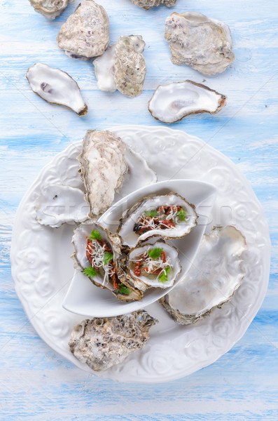 oysters with parmesan and baked tomatoes Stock photo © Dar1930