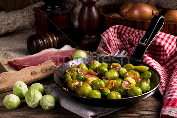 Stock photo:  Honey caramelized brussels sprouts with ham