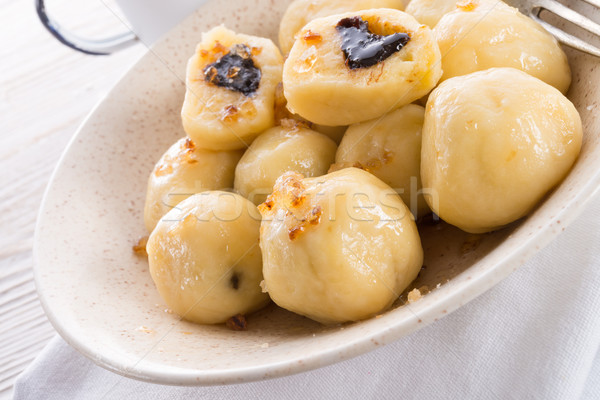 Stock photo: Potato dumplings with plums full