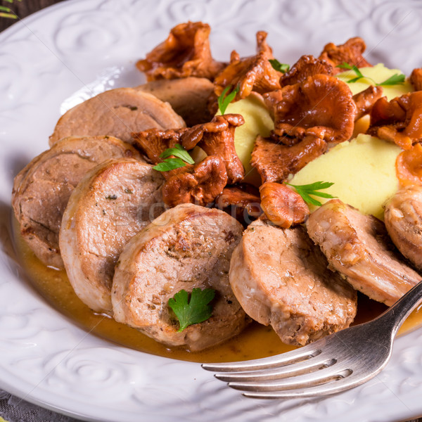Mashed potatoes with pork medallions and chanterelle sauce Stock photo © Dar1930