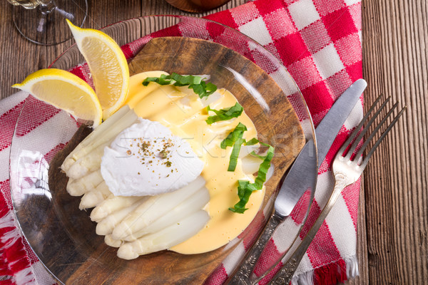white asparagus served with a fine hollandaise sauce and Poache Stock photo © Dar1930