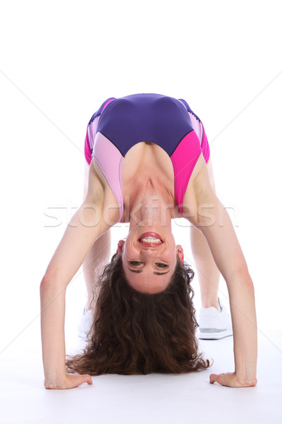 Beautiful cheerful young woman fitness crab pose Stock photo © darrinhenry