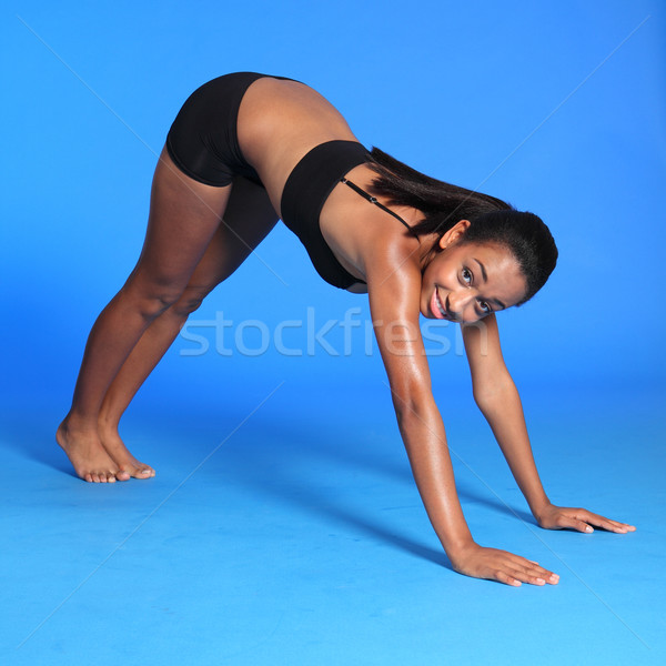 Calf stretch by fit African American woman Stock photo © darrinhenry
