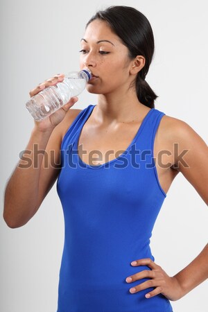 Piękna dziewczyna śmiechem woda butelkowana zdrowia Zdjęcia stock © darrinhenry